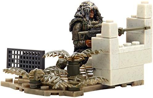 Ghillie suit sniper micro figure crouched on a rocky firebase